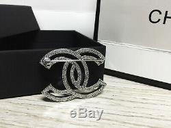 Breastpin Chanel 17 Outline Cutout Crystal CC Logo 18K White Gold Brooch Pin