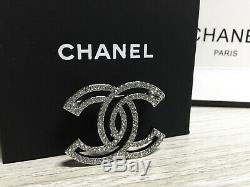 Breastpin Chanel 17 Outline Cutout Crystal CC Logo 18K White Gold Brooch Pin